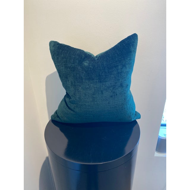 This luxurious decorative pillow, featured in a rich pine hue, offers a sophisticated touch to any interior design...