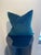 This luxurious decorative pillow, featured in a rich pine hue, offers a sophisticated touch to any interior design...