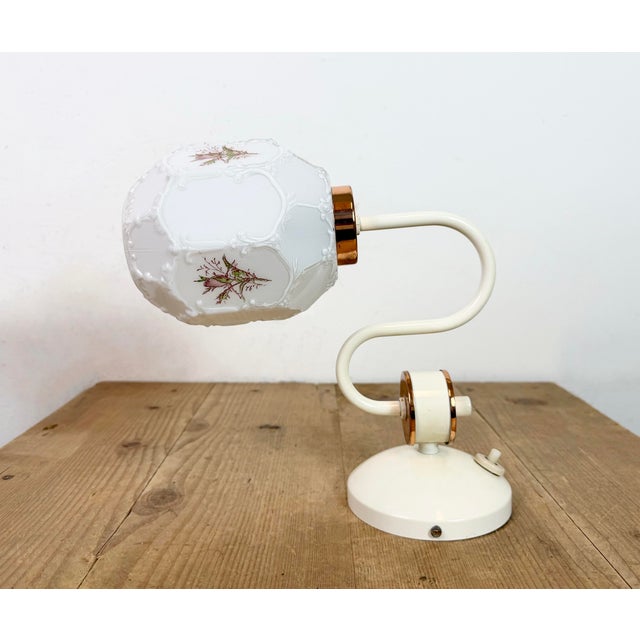 Vintage industrial wall light made by Drukov in former Czechoslovakia during the 1960s It features an iron wall mounting...