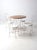 This antique ice cream parlor set features a wrought iron bistro table with a wood tabletop and four matching chairs. The...