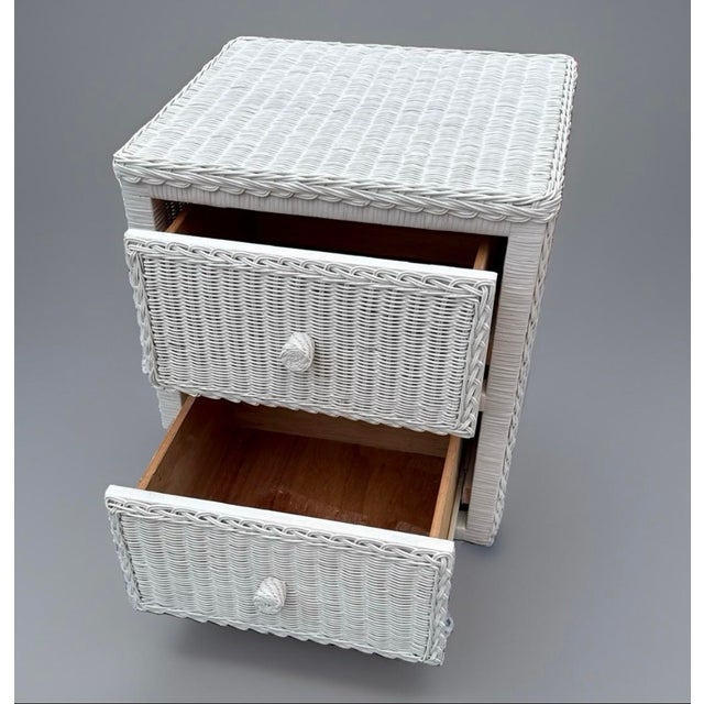 1980s coastal/boho chic white wicker nightstand with 2 drawers and a glass top. Features a sturdy solid wood drawer...