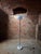 Papavero model floor lamp designed in 1964 by Achille Castiglioni for Flos. The name derives from the milk glass lampshade...