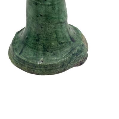 A Moroccan Tamegroute glazed candlestick holder is a handcrafted piece made in the historic pottery village of Tamegroute...
