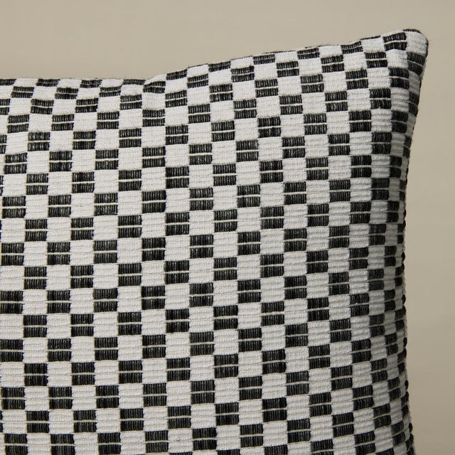 This pillow features Elkart with a knife edge finish. Elkhart is a soft, artisanal small woven check with a wonderfully...