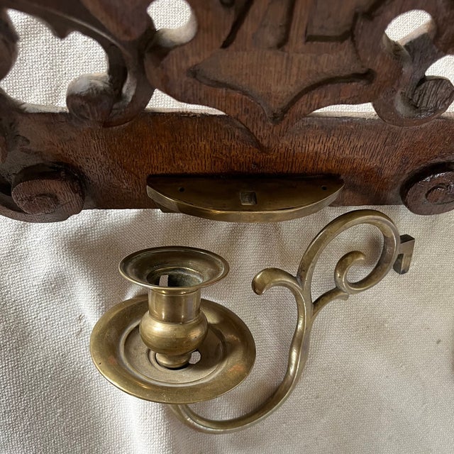 Beautiful pair of Swiss black forest candle sconces with original brass hardware. The candle holders are removable and...