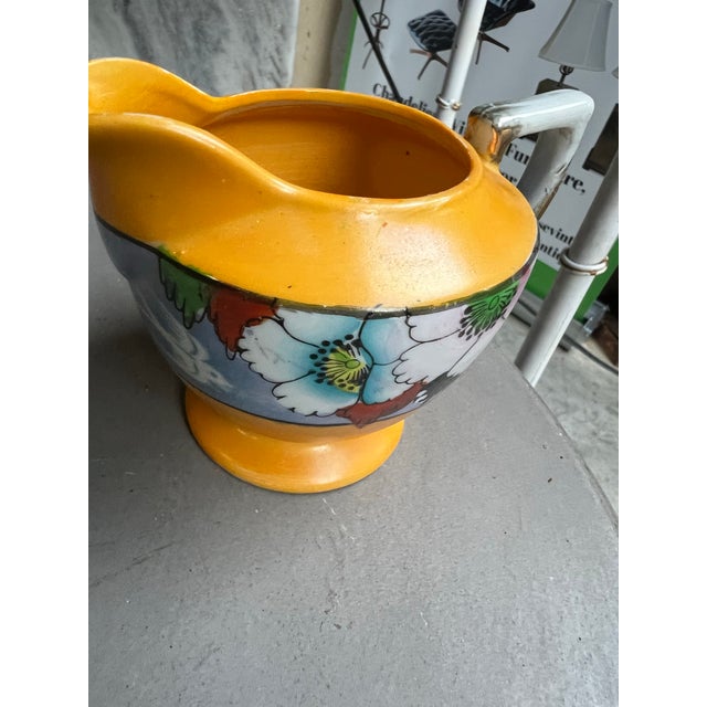 Up for consideration is a beautiful vintage small ceramic floral creamer cup. This would look lovely in your home, and it...