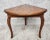 Vintage Lane Furniture accent table, circa 1960s. featuring triangular form with drop leaf design, book match top and...