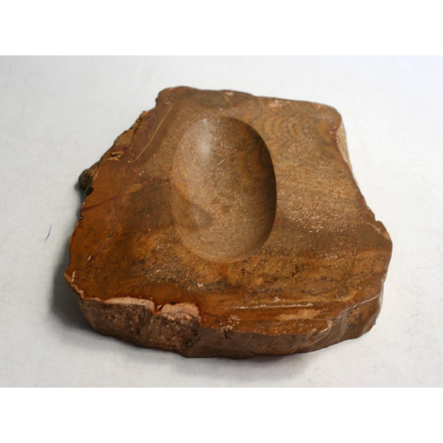 This ashtray was manufactured in the 1970s in Spain. It was formed from fossilised wood.