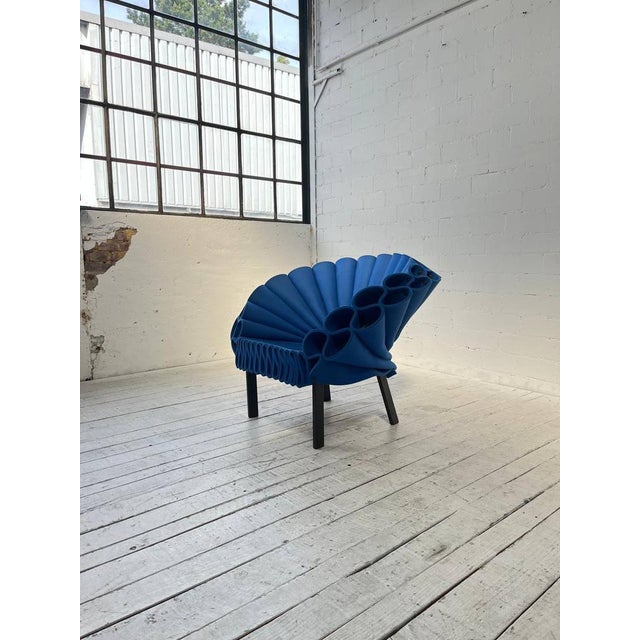 An extravagant newcomer: The Peacock Chair, designed by Dror Benshetrit and manufactured by Cappellini. The seat shell...