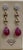 45 Carats of two Ruby drops and Diamond Hanging Earrings 14 K Yellow Gold This exquisite pair of earrings are beautifully...