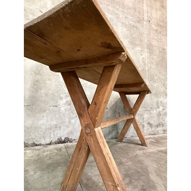 Wonderful antique Swedish pine sawbuck table — a long, lean, honest piece of Scandinavian country furniture with exactly...