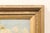 A French landscape painting in frame from the early 20th century. This antique painting from France depicts a tranquil...
