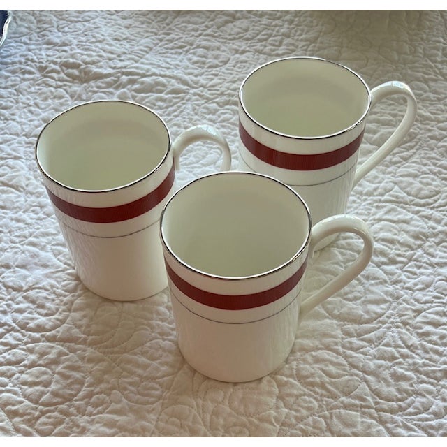 Lauren Ralph Lauren Normandy Crimson Mugs - Discotinued. 4" tall / 3" diameter / 12 oz. White with crimson ribbed band and...
