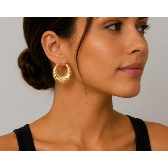 14k Yellow Gold earrings. Twisted hoop design. Total weight 7.95 g.