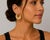 14k Yellow Gold earrings. Twisted hoop design. Total weight 7.95 g.