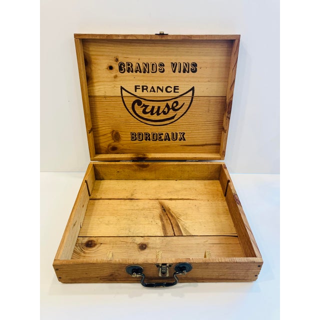 This 50’s vintage wine box was made to ship four bottles of Bordeaux from Cruse Vineyards The handle was added later and...