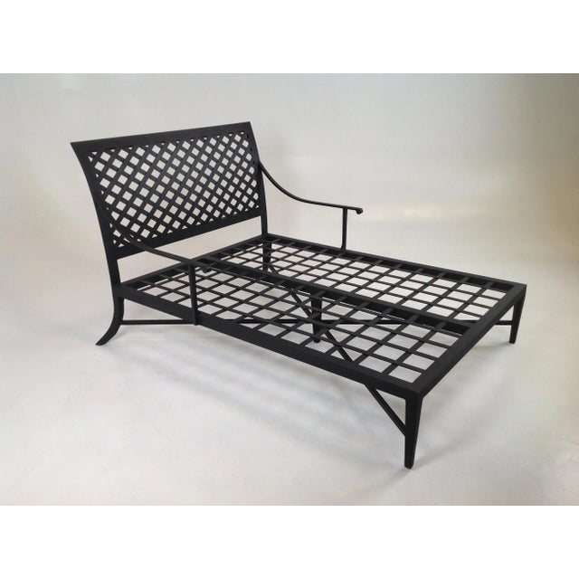 Modern Patio double chaise lounge. The chaise is aluminum/iron. The chaise is powder coated in matte black. The chaise is...