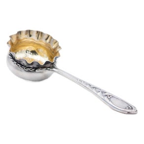 Silver Tea Strainer with Gold Interior and Reliefs on the Handle For Sale