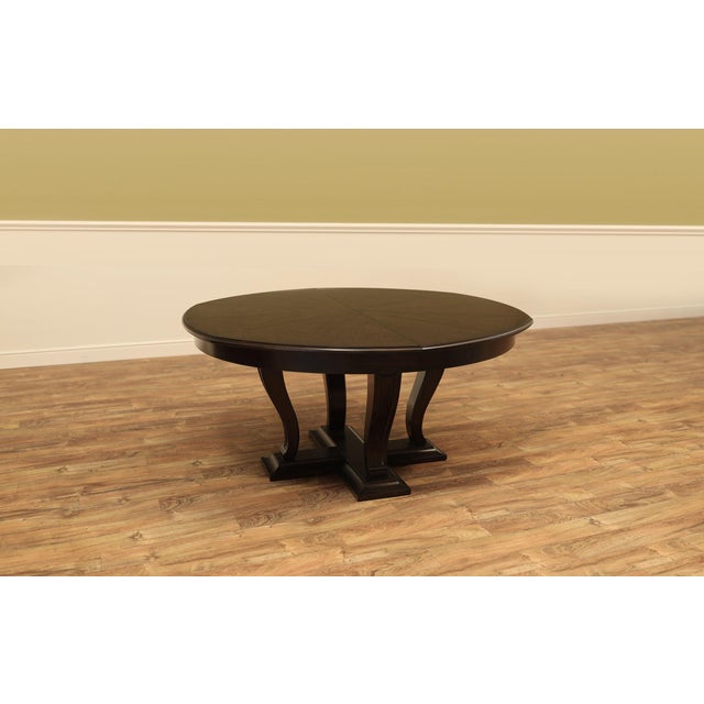 Solid oak Jupe-style dining table designed to seat 6 to 10 people. This large transitional table expands from 64 inches to...