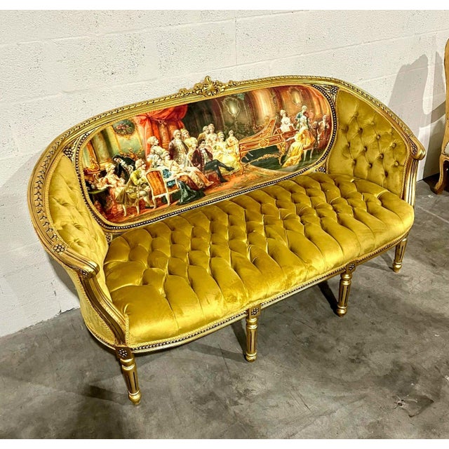 An extraordinary French statement sofa, fully restored with genuine 24K gold leaf and upholstered in rich mustard fabric....