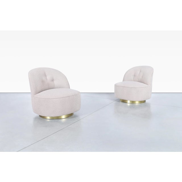 With their soft, sculptural silhouette and glamour, this pair of vintage swivel lounge chairs captures the effortless...
