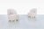 With their soft, sculptural silhouette and glamour, this pair of vintage swivel lounge chairs captures the effortless...
