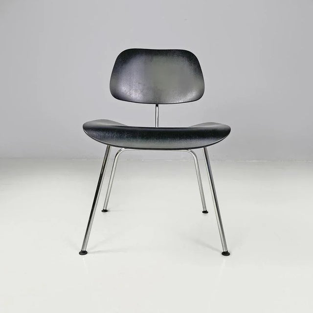German postmodern black wooden chairs by Charles and Ray Eames for Vitra, 2000s Pair of chairs model DCM in black wood....