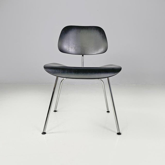 German postmodern black wooden chairs by Charles and Ray Eames for Vitra, 2000s Pair of chairs model DCM in black wood....