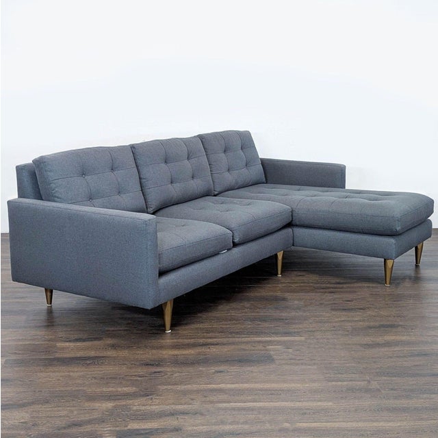 This Crate & Barrel sectional features a modern design with clean lines and a right-facing chaise. Upholstered in a...