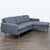 This Crate & Barrel sectional features a modern design with clean lines and a right-facing chaise. Upholstered in a...