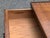 This vintage low-profile end table marries architectural rigor with mid-century elegance. Defined by its dramatic banded...