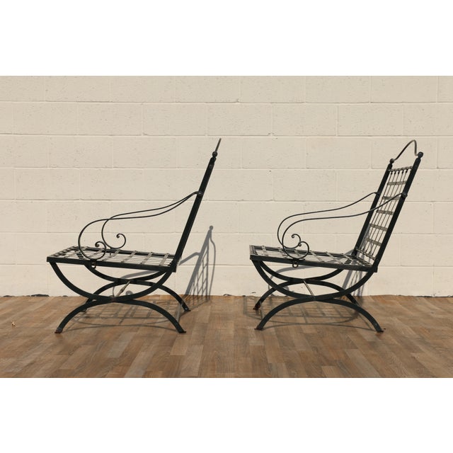 Exceptional vintage pair of wrought iron outdoor folding armchairs attributed to Hervé Baume, France, 1970s. These...