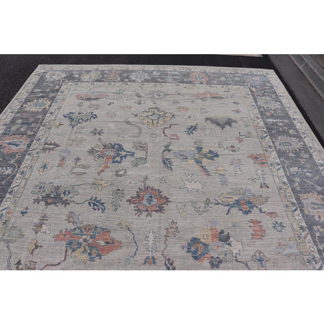 Modern Oushak Rug With Slate Blue Border and Colorful All-Over Tribal Motifs For Sale - Image 4 of 15