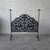 This is vintage wrought iron fireplace screen featuring hand pierced floral decoration and a pair of stylized deer. The...
