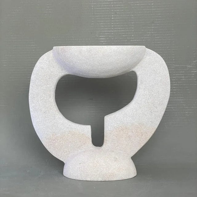 Hand carved marble vessel by tom von kaenel materials: marble dimensions: w 12 x d 28 x h 26 cm this piece is attributed...