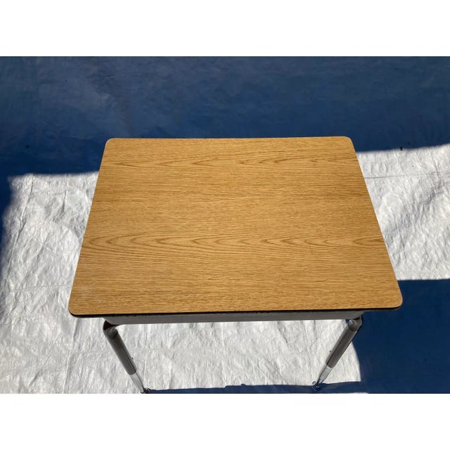 C.1970’s School Desk with Adjustable legs with maximum height of 30” and maximum knee hole height of 24”. Brown rubberized...