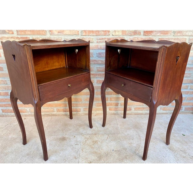 Elegant pair of Louis XV style bedside tables crafted in solid wood, featuring refined cabriole legs and softly curved...