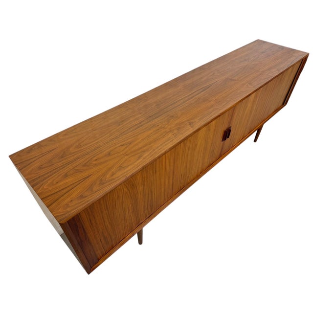 Sleek and timeless, this 1960’s Danish modern sideboard by FAARUP showcases the clean lines and exceptional craftsmanship...