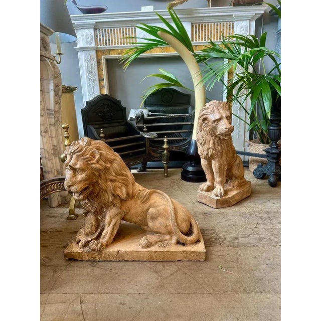 A Set of European 19th century terracotta lions. One seated stood on a shaped plinth, expressive face, detailed mane and...