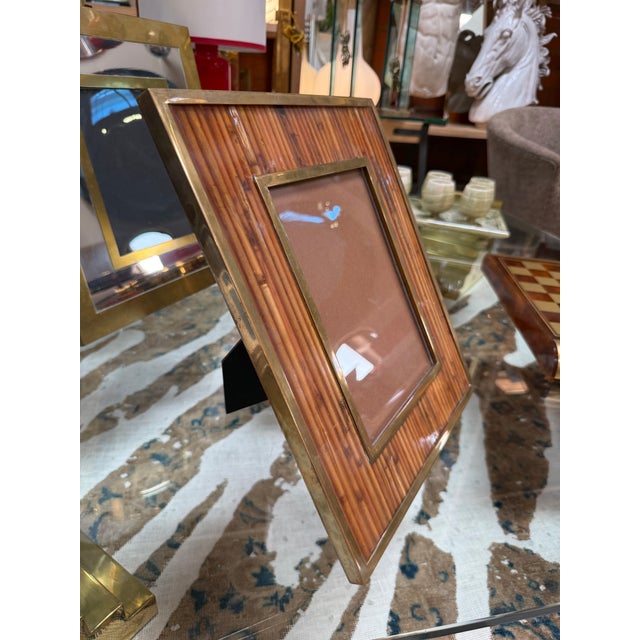 Elegant Italian mid-century picture frame crafted in the 1970s, featuring a warm brass border surrounding a finely...