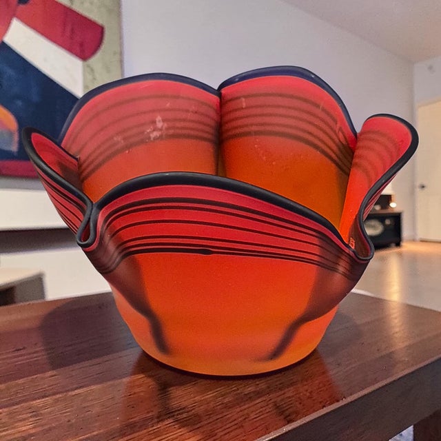 The Vintage Mid-Century Modern Rosenthal Art Glass vase from Germany features a striking coral red and black design that...