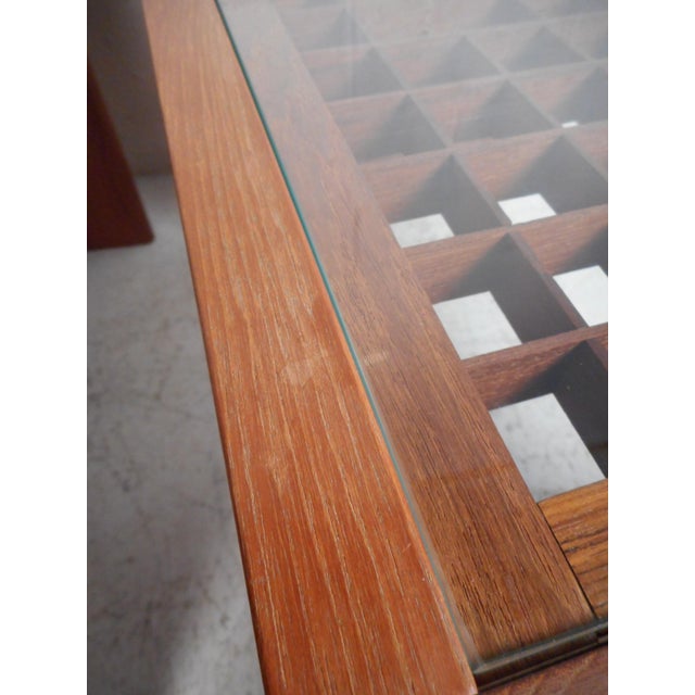 Unique Danish modern end tables by Komfort. Very unusual design with a tabletop comprised of an intricate wooden...