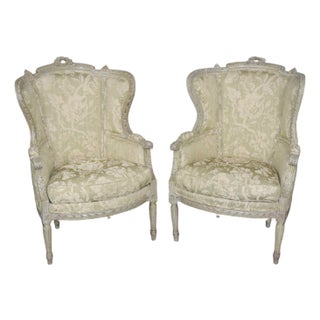 Pair of French Louis XVI Style Distressed Painted Wingback Bergere Chairs For Sale