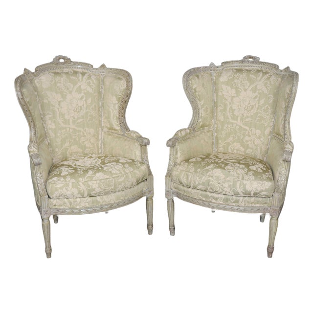 Pair of French Louis XVI Style Distressed Painted Wingback Bergere Chairs For Sale