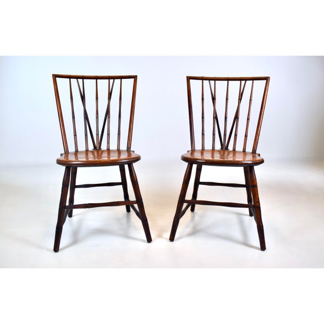 A pair of mid 20th c. Birdcage Windsor side chairs with braced back design and nicely patinated original finish. A classic...