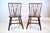 A pair of mid 20th c. Birdcage Windsor side chairs with braced back design and nicely patinated original finish. A classic...