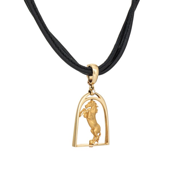 Stylish pre-owned Carrera y Carrera Horse necklace crafted in 18k yellow gold (circa 2000s). Diamond totals an estimated...