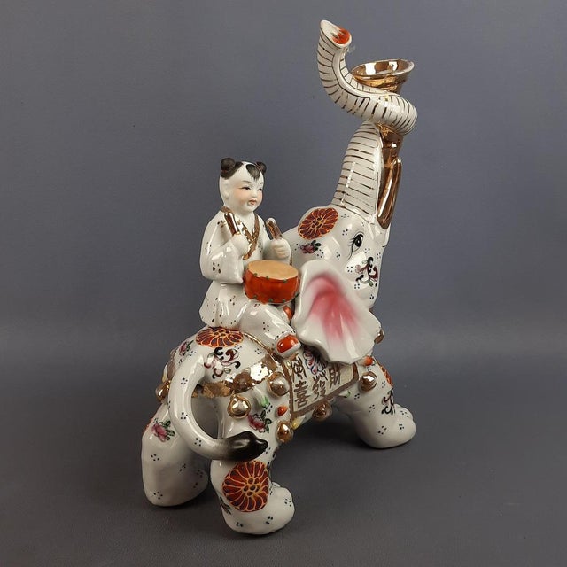 A wonderful vintage oriental porcelain sculpture, attributed to fine Chinese craftsmanship from the mid-20th century....