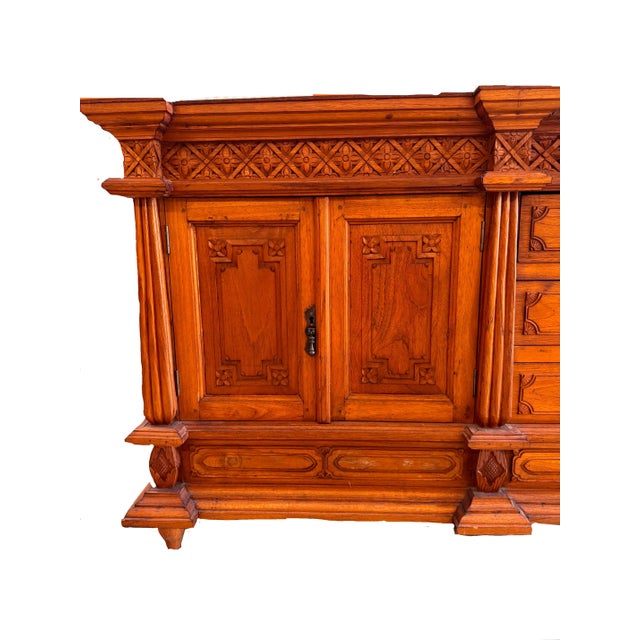 This striking 1980s Mexican carved oak credenza effortlessly blends traditional craftsmanship with timeless...
