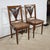 Each of these two massive mahogany chairs consists of a large framing base, with rounded front angles. This supervision is...